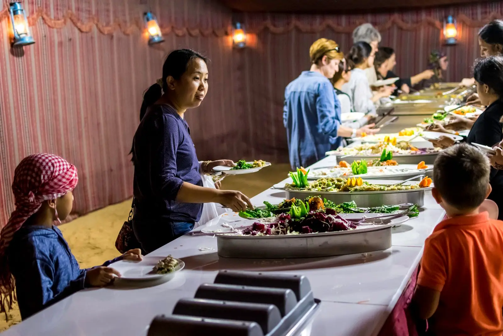 Guests serving food at a buffet